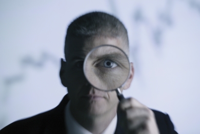 man holding a magnifying glass