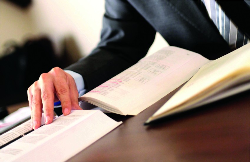 men in suit reading books